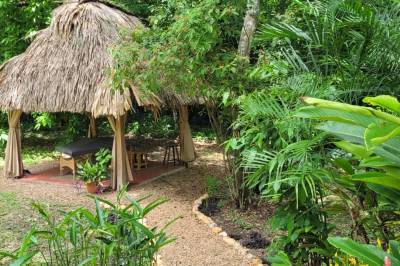 Jungle spa experience under the cool of a thatch roof in nature, Balance Point Wellness Belize, Bullet Tree Falls
