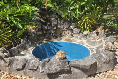 Our stone tub - for cocunut milk baths and Maya spiritual bathing, Balance Point Wellness Belize, Bullet Tree Falls